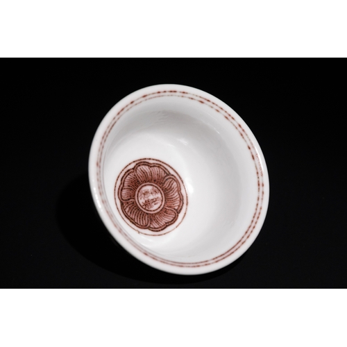 103 - A Chinese Porcelain Bowl with Red Floral Motif.

This Chinese porcelain teacup features intricate re... 