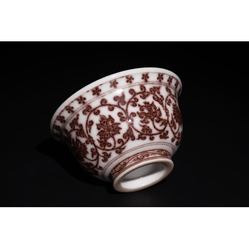 103 - A Chinese Porcelain Bowl with Red Floral Motif.

This Chinese porcelain teacup features intricate re... 