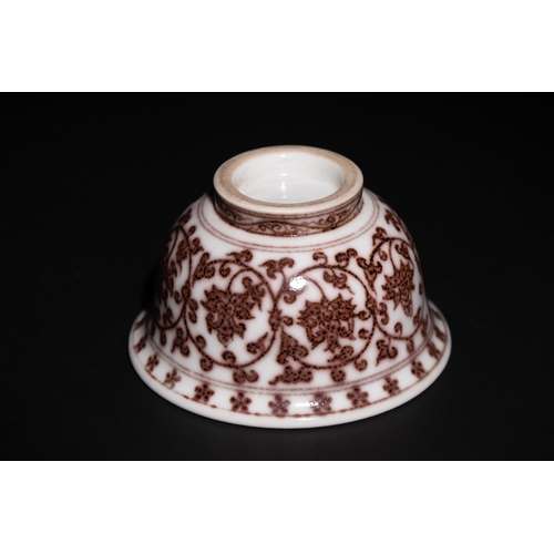 103 - A Chinese Porcelain Bowl with Red Floral Motif.

This Chinese porcelain teacup features intricate re... 
