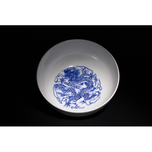 108 - A Chinese Blue and White Porcelain Bowl with Dragon Motif & Six Character Marks to the Base.

A Chin... 