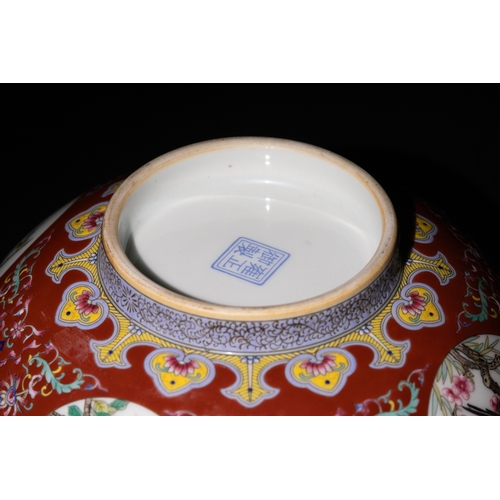109 - A Chinese Porcelain Red Ground Bowl with Floral and Bird Motifs & Four Character Marks to the Base.
... 