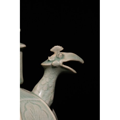 111 - A Chinese Celadon Ewer with Phoenix Spout and Floral Motifs.

A Chinese celadon-glazed ewer featurin... 