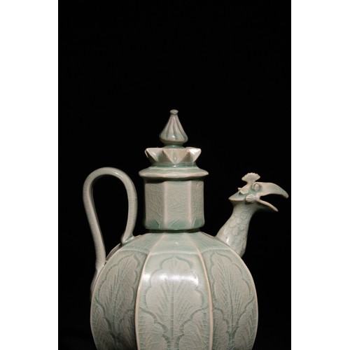 111 - A Chinese Celadon Ewer with Phoenix Spout and Floral Motifs.

A Chinese celadon-glazed ewer featurin... 