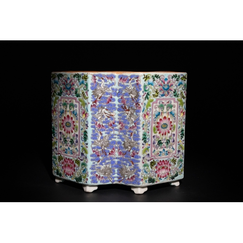 113 - A Chinese Famille Rose Hexagonal Porcelain Brush Pot with Floral and Crane Motifs.

A vibrant Chines... 