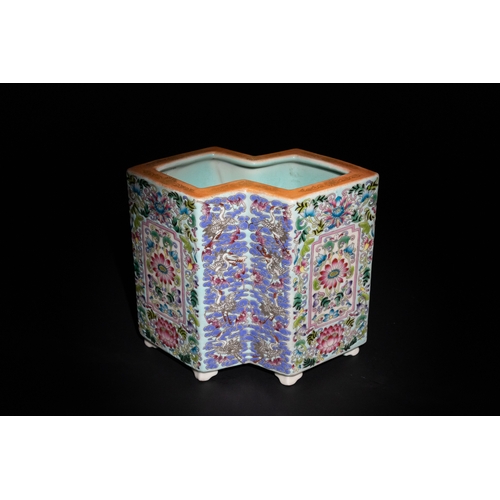 113 - A Chinese Famille Rose Hexagonal Porcelain Brush Pot with Floral and Crane Motifs.

A vibrant Chines... 