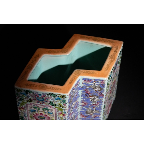 113 - A Chinese Famille Rose Hexagonal Porcelain Brush Pot with Floral and Crane Motifs.

A vibrant Chines... 