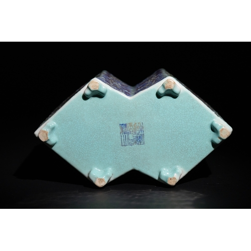 113 - A Chinese Famille Rose Hexagonal Porcelain Brush Pot with Floral and Crane Motifs.

A vibrant Chines... 