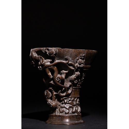 115 - A Chinese Libation Cup with Dragon and Floral Motifs & Six Character Marks on the Base.

This Chines... 