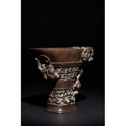 115 - A Chinese Libation Cup with Dragon and Floral Motifs & Six Character Marks on the Base.

This Chines... 