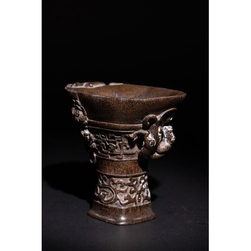 115 - A Chinese Libation Cup with Dragon and Floral Motifs & Six Character Marks on the Base.

This Chines... 