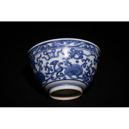 117 - A Chinese Blue and White Porcelain Bowl with Floral Motif.

This blue and white porcelain bowl featu... 