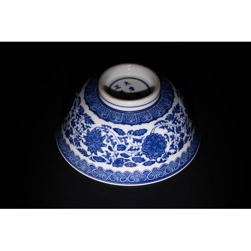 119 - A Chinese Blue and White Porcelain Bowl with Floral and Scroll Motifs & Six Character Marks to the B... 