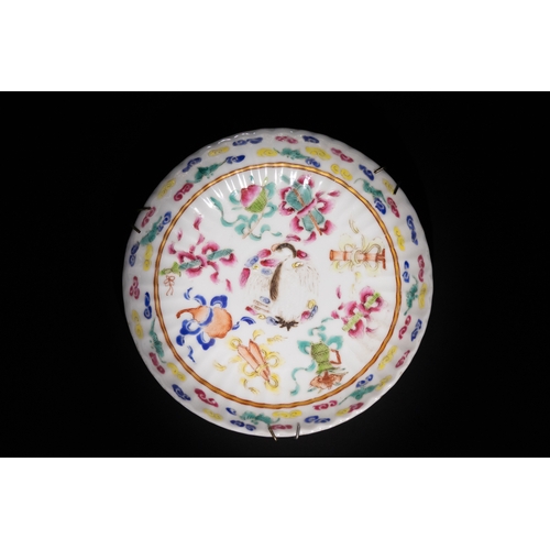 121 - A Chinese Famille Rose Porcelain Plate with Floral Motifs & Six Character Marks to the Base.

This C... 