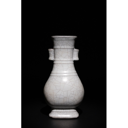 127 - A Chinese Crackle Glaze Vase with Wooden Box.

The vase is characterized by its symmetrical dual han... 