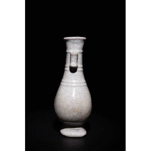 127 - A Chinese Crackle Glaze Vase with Wooden Box.

The vase is characterized by its symmetrical dual han... 