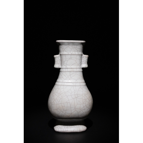 127 - A Chinese Crackle Glaze Vase with Wooden Box.

The vase is characterized by its symmetrical dual han... 