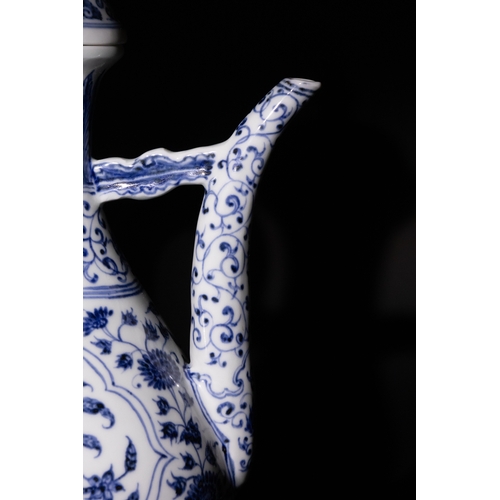 130 - A Chinese Blue and White Porcelain Ewer with Floral Motifs and Curved Handle & Six Character Marks t... 