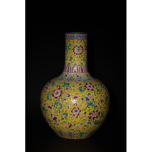 131 - A Chinese Yellow Ground Famille Bottle Vase with Floral and Scrollwork Design.

A vase with a yellow... 