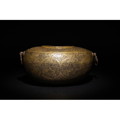 9 - A Qajar Brass Kashkul Beggar's Bowl with Engraved Decorative Panels and Calligraphy.

This Qajar bra... 