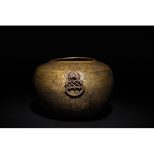 9 - A Qajar Brass Kashkul Beggar's Bowl with Engraved Decorative Panels and Calligraphy.

This Qajar bra... 