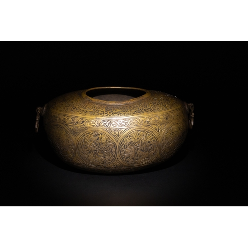 9 - A Qajar Brass Kashkul Beggar's Bowl with Engraved Decorative Panels and Calligraphy.

This Qajar bra... 