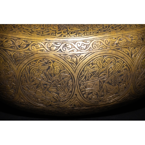 9 - A Qajar Brass Kashkul Beggar's Bowl with Engraved Decorative Panels and Calligraphy.

This Qajar bra... 