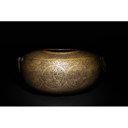 9 - A Qajar Brass Kashkul Beggar's Bowl with Engraved Decorative Panels and Calligraphy.

This Qajar bra... 