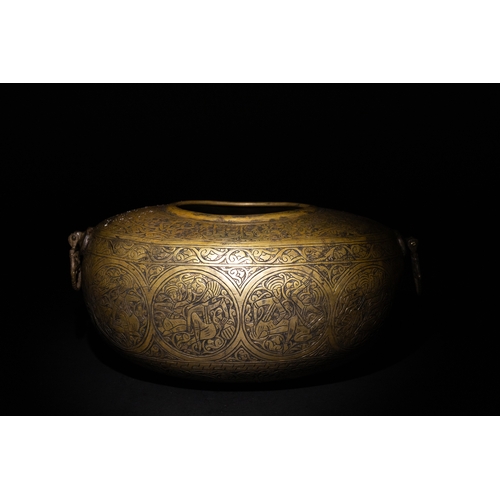 9 - A Qajar Brass Kashkul Beggar's Bowl with Engraved Decorative Panels and Calligraphy.

This Qajar bra... 