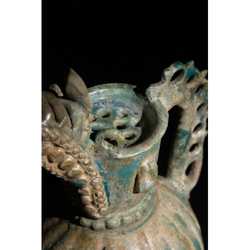 11 - An Islamic Khorassan Glazed Ceramic Ewer with Ornate Spout and Handle, 12th Century.

This ceramic e... 