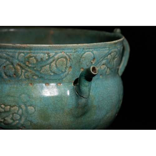 12 - An Islamic Khorassan Glazed Ceramic Bowl with Intricate Motifs and Handles, 12th Century.

This Isla... 