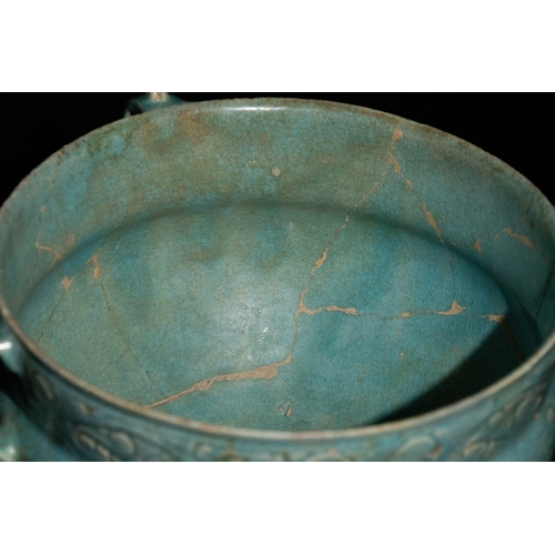 12 - An Islamic Khorassan Glazed Ceramic Bowl with Intricate Motifs and Handles, 12th Century.

This Isla... 