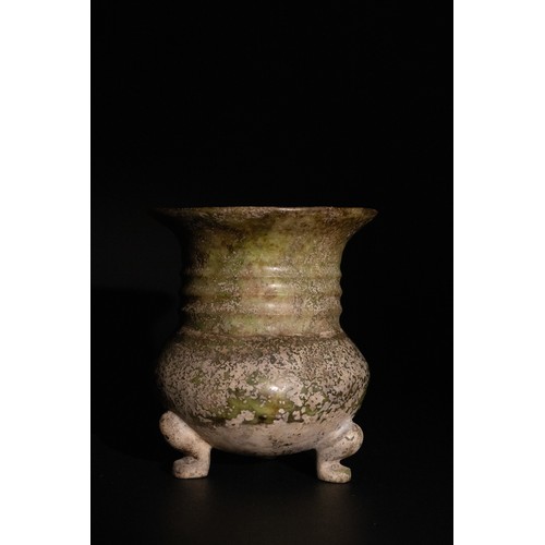 309 - **NO RESERVE**

A Chinese Jade Tripod Vase with a Weathered Green Patina.

A Chinese jade vase stand... 