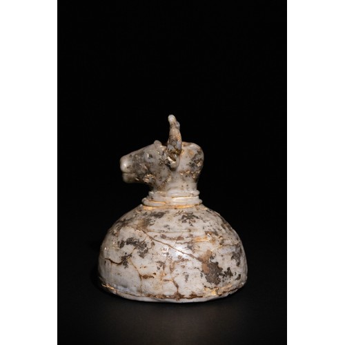 43 - **NO RESERVE**

An Islamic Glass Bull-Form Vessel with a Domed Body, Possibly Ancient.

A sculptural... 