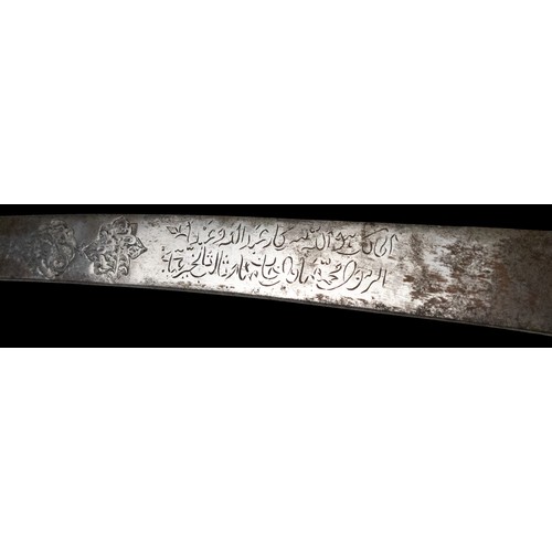 16 - A Timurid-Mughal Inscribed Sword with Silver Wirework.

A Timurid-Mughal saber featuring a deeply cu... 