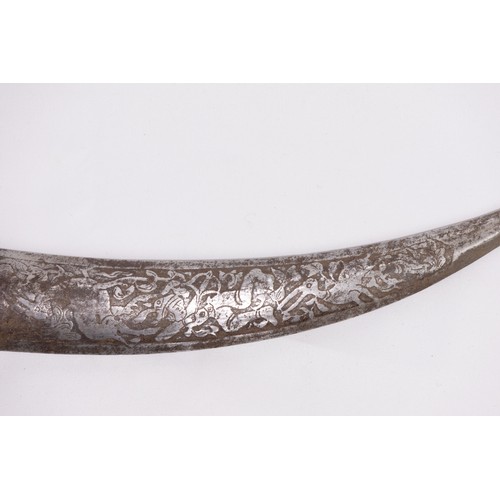 54 - **NO RESERVE**

A Persian Iron Dagger with Islamic Calligraphy and Engraved Hunting Motifs.

An elon... 