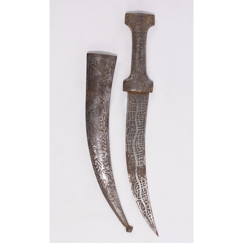 54 - **NO RESERVE**

A Persian Iron Dagger with Islamic Calligraphy and Engraved Hunting Motifs.

An elon... 