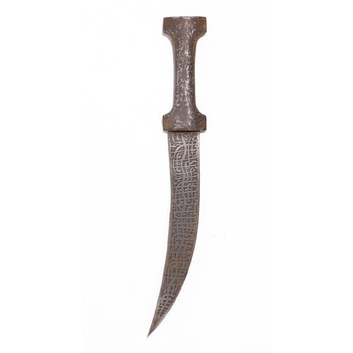 54 - **NO RESERVE**

A Persian Iron Dagger with Islamic Calligraphy and Engraved Hunting Motifs.

An elon... 