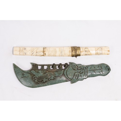 317 - **NO RESERVE**

A Chinese Jade and Bone Dagger with Carved Dragon Motifs.

A Chinese dagger with a j... 