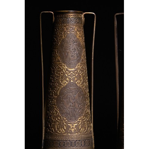 57 - **NO RESERVE**

A Pair of Kinco Brass Double-Handled Vases, Made for the Persian Market.

A pair of ... 