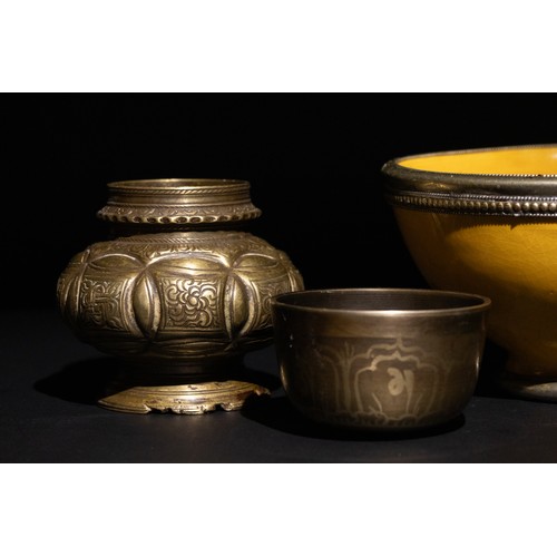 60 - **NO RESERVE**

A Lot of Four Eastern Vessels Including a Moroccan Safi Yellow Bowl.

A Moroccan Saf... 