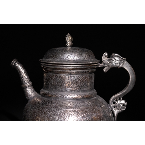 19 - An Islamic Timurid Copper Ewer with Engraved Calligraphy and Dragon Handle.

A copper ewer featuring... 