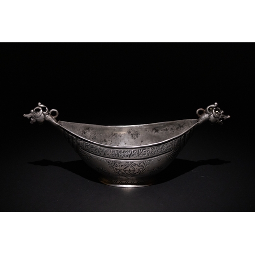 22 - An Islamic Safavid Copper Kashkul Beggar's Bowl with Dragon Head Terminals.

A copper Kashkul beggar... 