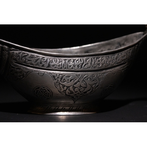 22 - An Islamic Safavid Copper Kashkul Beggar's Bowl with Dragon Head Terminals.

A copper Kashkul beggar... 