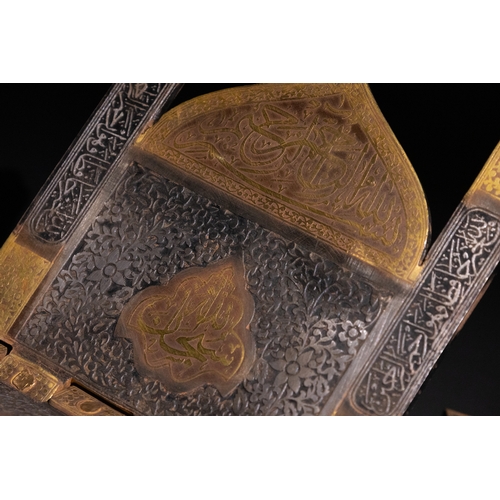 24 - An Islamic Gold Inlaid Steel Quran Holder, 19th-20th Century.

A steel Quran holder with gold inlay,... 