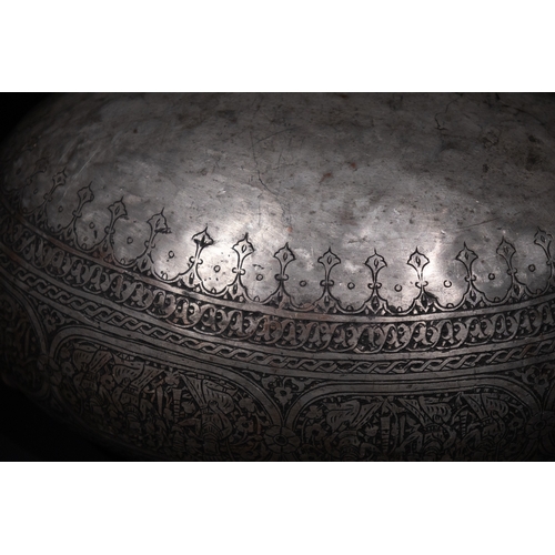 28 - An Islamic Iron Kashkul Beggar's Bowl with Courtly Figures & Floral Patterns.

A finely crafted iron... 