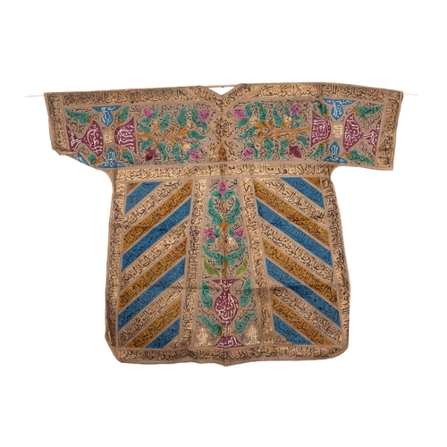 37 - An Ottoman Talismanic Shirt with Multicolored Calligraphic Inscriptions and Floral Motifs.

A talism... 