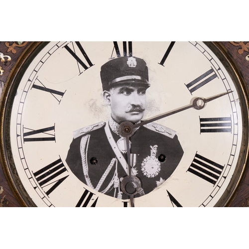 9 - A Pahlavi Wall Clock with Portrait of Reza Shah, Iran, Early 20th Century.

A rare Persian wall cloc... 