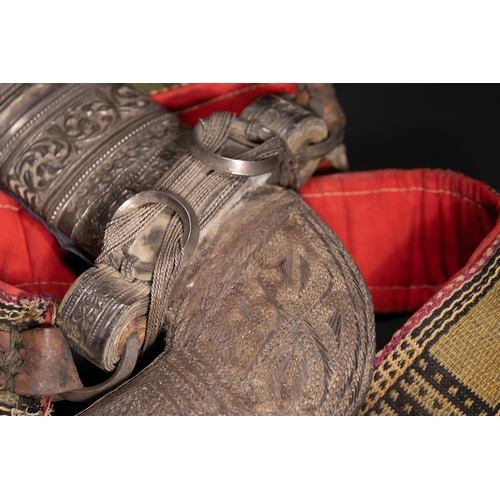 14 - A White Metal Curved Dagger Jambiya with Rhino Horn Hilt, Oman or Yemen, 19th Century.

The hilt is ... 