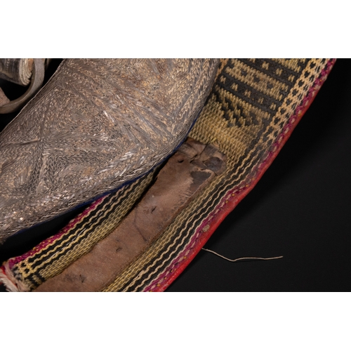 14 - A White Metal Curved Dagger Jambiya with Rhino Horn Hilt, Oman or Yemen, 19th Century.

The hilt is ... 