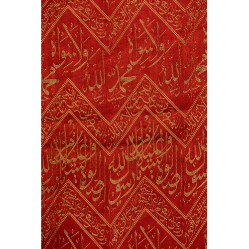 16 - An Ottoman Fragment of the Kaaba Kiswa.

Crafted in rich crimson with woven threaded inscriptions, t... 